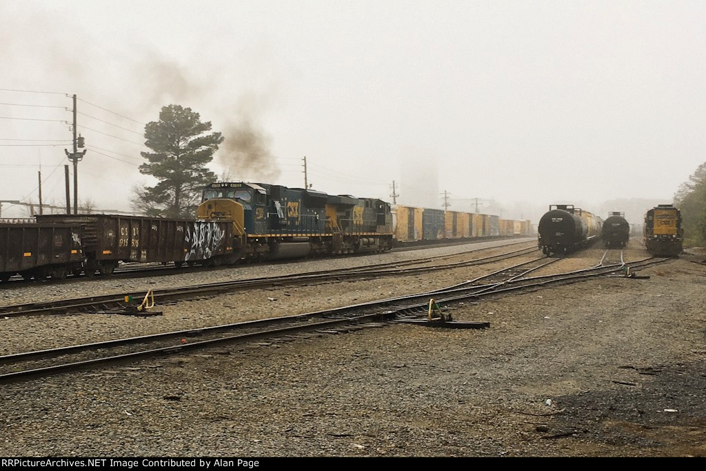 CSX 5312 and a smoking 4705 hustle through the yard